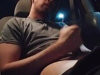 Sitting in his car
