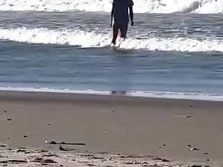 Random guy on beach with huge bulge