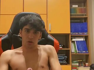 Boy masturbating with huge cock on show