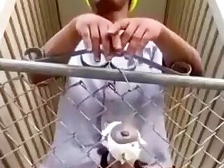 Boy fucking fleshlight in a fence in public