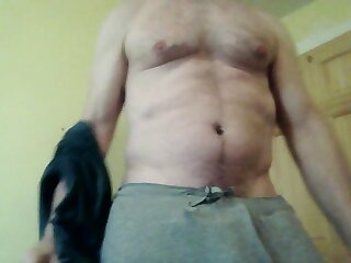 Stripping down and exposing hairy nut sack.