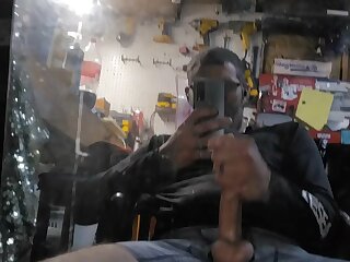 Man jerking off and busting a fat load on a mirror