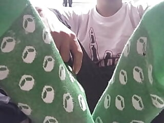Long green socks and sweaty feet in your face