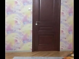 Crossdresser smokes and poses in long tight dress