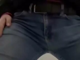 A man jeans bulge in a bathroom.