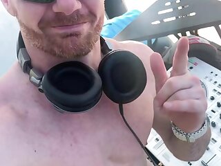 White bearded naked DJ dancing