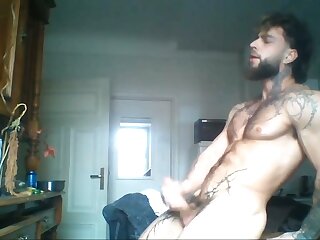 Tattooed stud cums hard