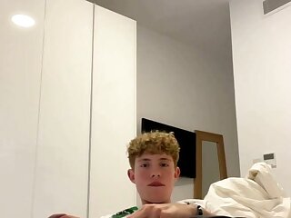Curly blond hunk jerking a Big Cock on the bed